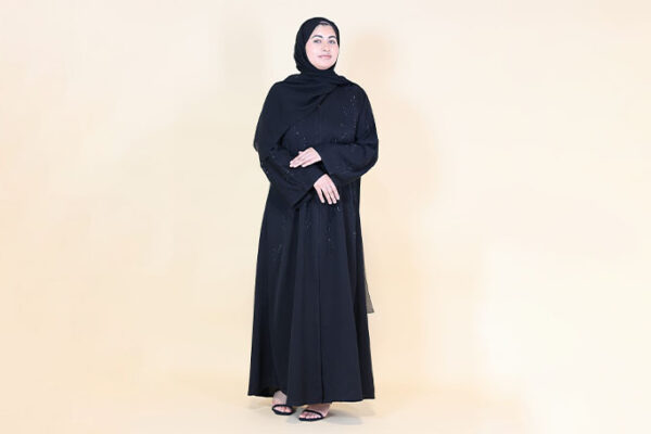 Woman wearing black embellished abaya