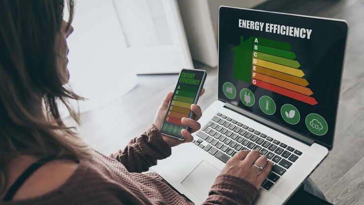 Woman comparing energy plans on her laptop to find better electricity deals in Victoria